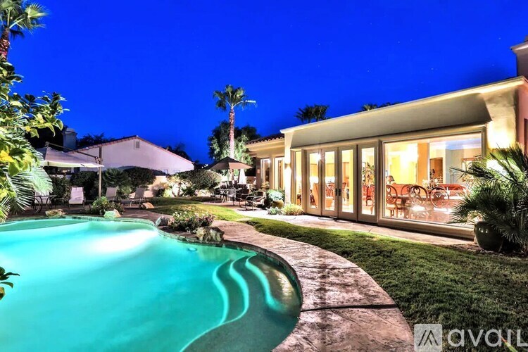 A house with a pool in the backyard.