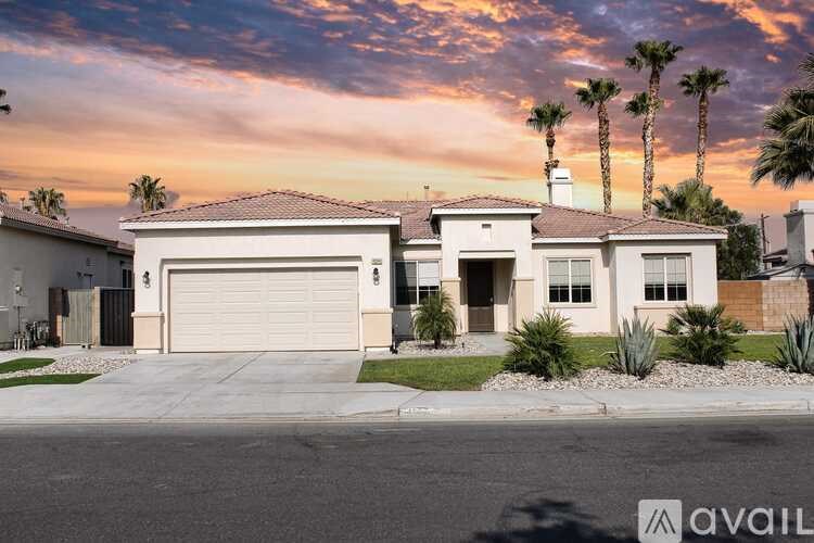 A house with a garage is available for sale.