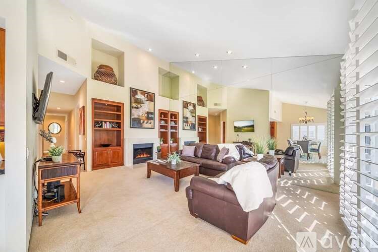 A living room with a fireplace and a couch.