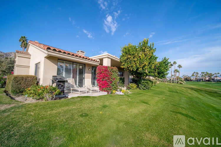 A house with a lawn in front of it.