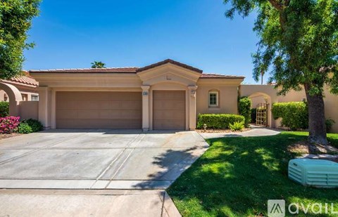 A house with a garage and a driveway.