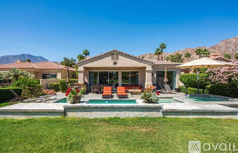 A house with a pool in the backyard.