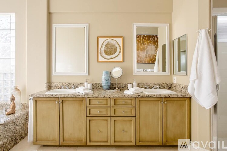 A bathroom with a vanity and a mirror.