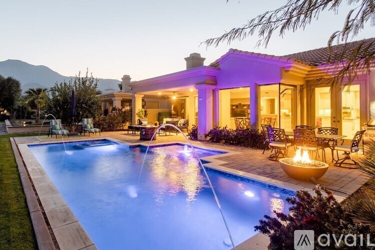 A house with a pool in the backyard.
