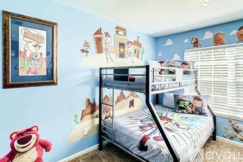 A child's bedroom with a bunk bed and a teddy bear.