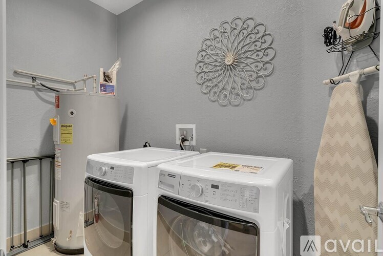 Two front loading washing machines in a laundry room.