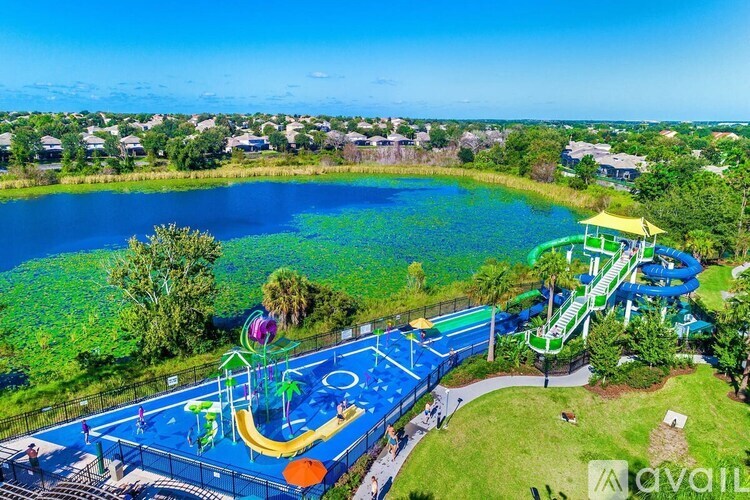 A playground with a blue slide and a yellow slide.