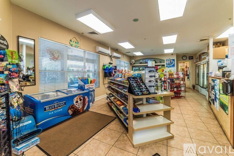 A store with a variety of products on display and a blue box with the words "Blue Bunny" on it.