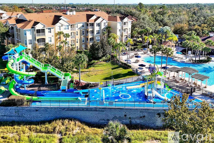 A water park with a slide and a pool.