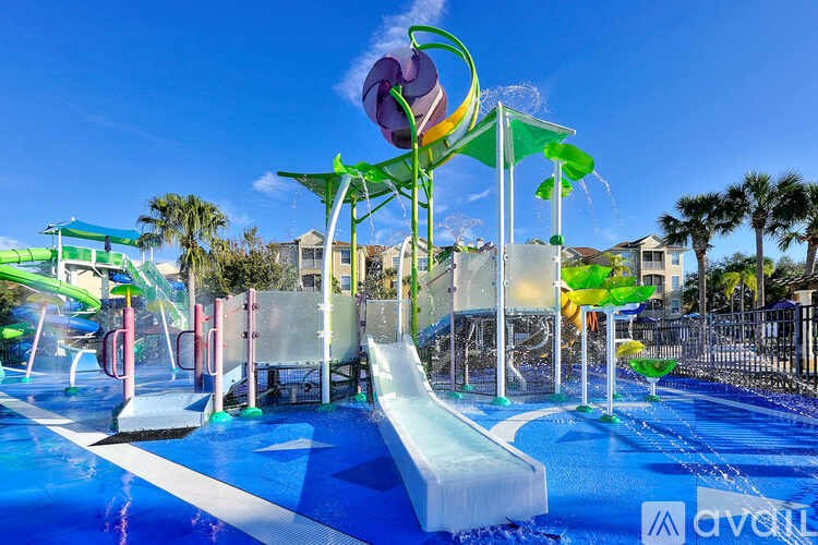 A water park with a slide and a waterfall.