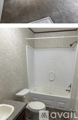A bathroom with a toilet, sink, and bathtub.
