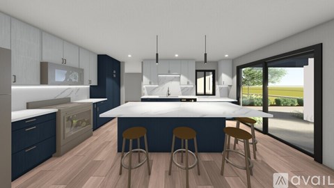 A modern kitchen with a large island and bar stools.