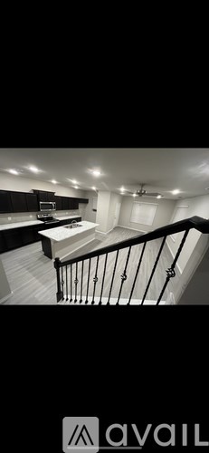 A black and white image of a staircase in a house.