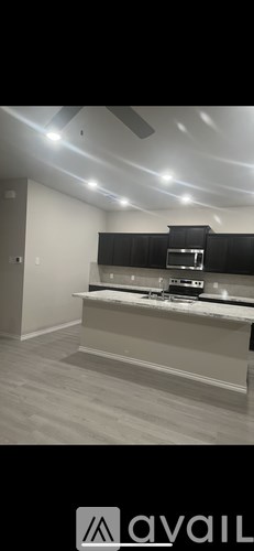 A modern kitchen with a stove top oven and a range hood.