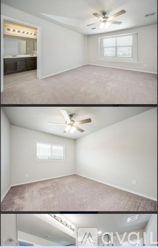 A living room with a ceiling fan and a window.