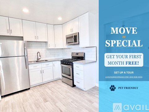 A kitchen with a refrigerator, oven, and microwave is on sale for the first month free.