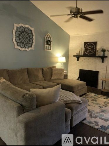 A living room with a fireplace and a couch.