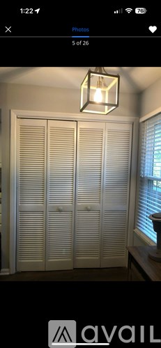 Closed white shutters on a window.