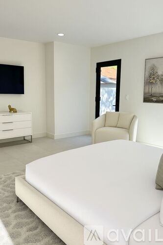 A bathroom with a toilet, sink, and shower.