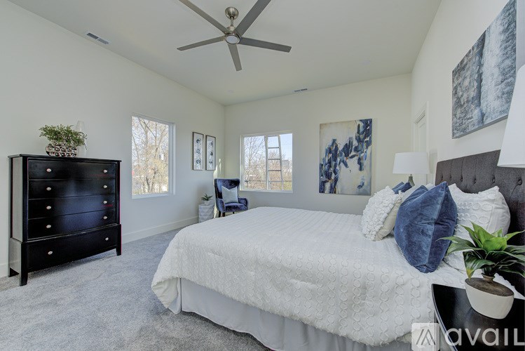 A kitchen with a refrigerator, dishwasher, and microwave.