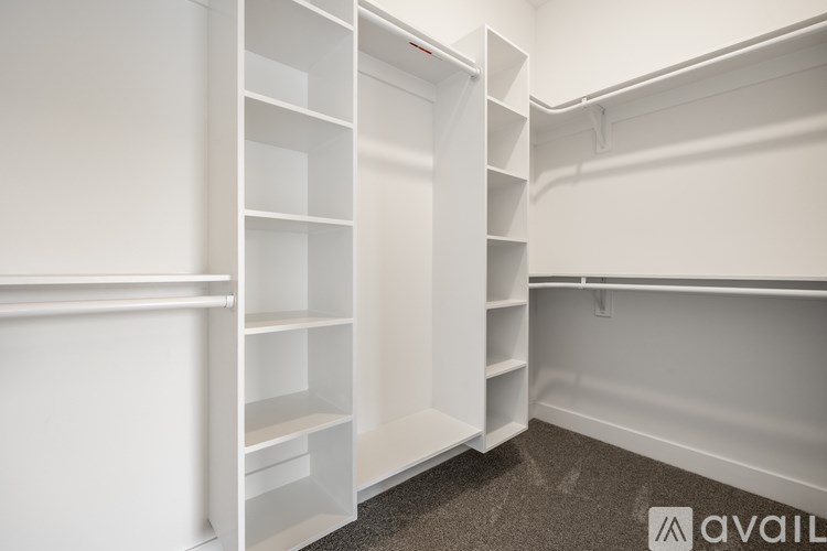 Empty white shelves in a room.