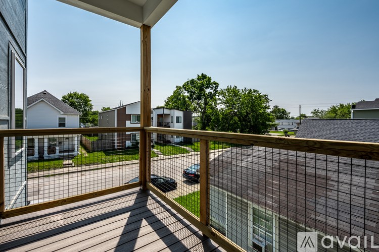 A balcony with a view of a residential area.