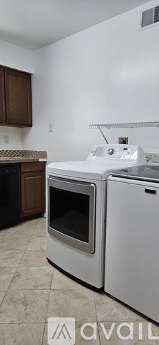 A white oven and microwave in a kitchen.