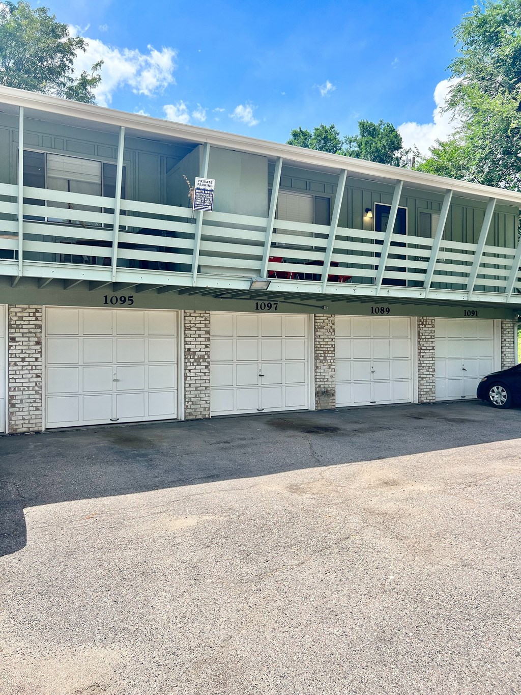 A parking garage with the numbers 1095, 1097, and 1089 visible on the wall.
