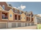 A row of houses with brown and tan exteriors.