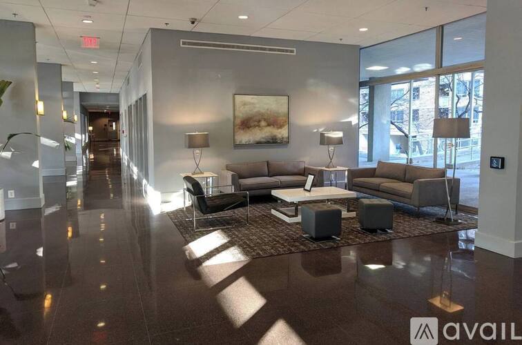 A spacious waiting area with a long hallway and seating arrangements.