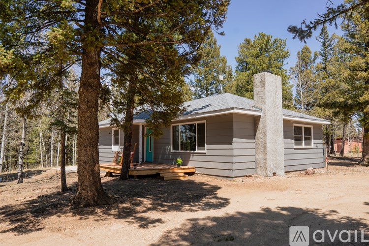 A house with a tree in front of it.