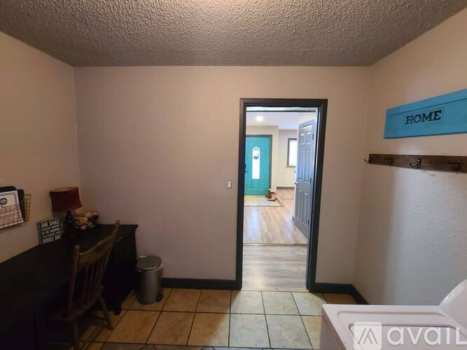 A room with a sign that says "HOME" on the wall.