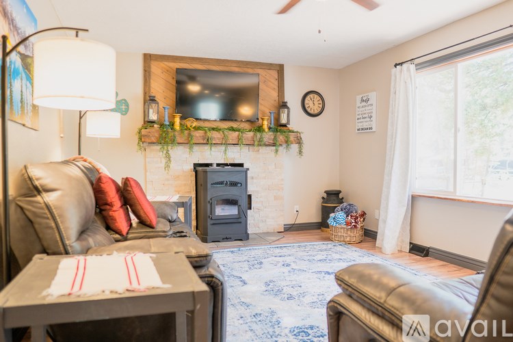 A living room with a fireplace and a couch.