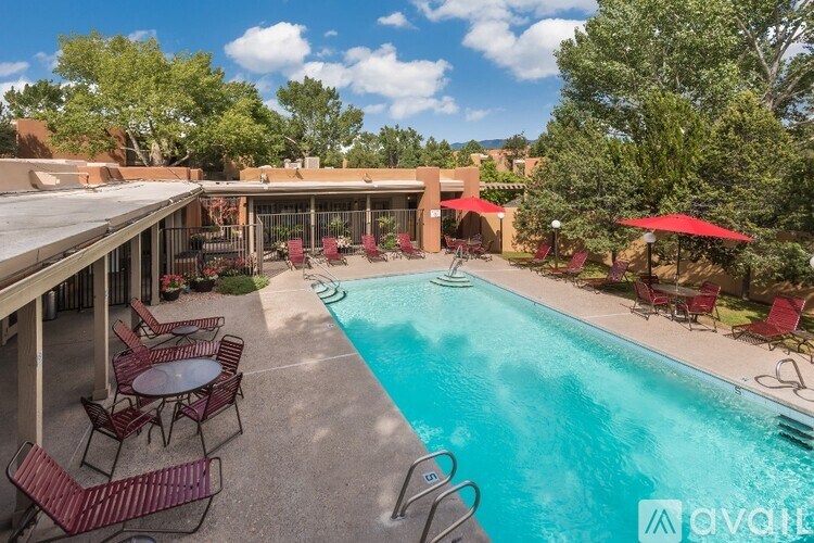 A pool area with chairs and tables is available.