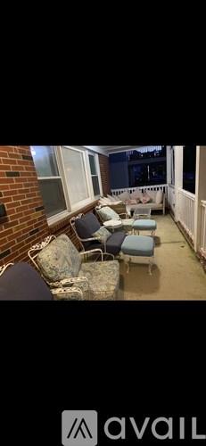 A patio with a table and chairs.