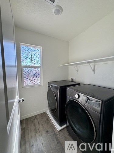 A laundry room with a washer and dryer.
