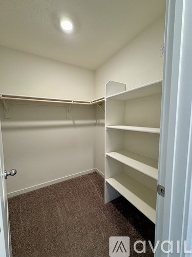 Empty white shelves in a room.