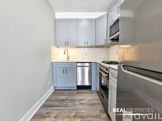 A kitchen with a stove top oven and a dishwasher.