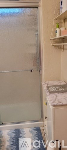 A white door with a handle is in the room.