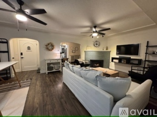 A kitchen with a table and chairs in the middle of the room.