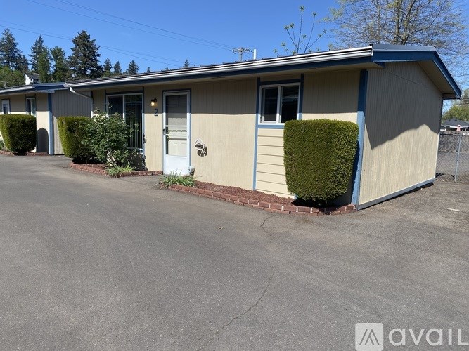 A row of houses with the first one for sale.