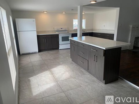 A kitchen with a white refrigerator and a white oven.