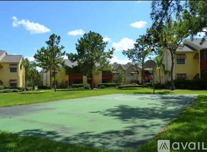 A residential area with houses and a green lawn.
