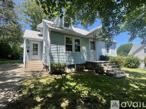 A house with a blue exterior is for sale.