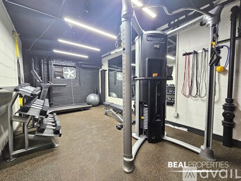 The image shows a building entrance with a sign that reads "BEAL PROPERTIES".