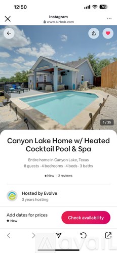 A pool in front of a house with a sign that says Canyon Lake Home with Heated Cocktail Pool & Spa.