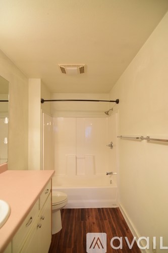 A living room with a kitchen in the background.