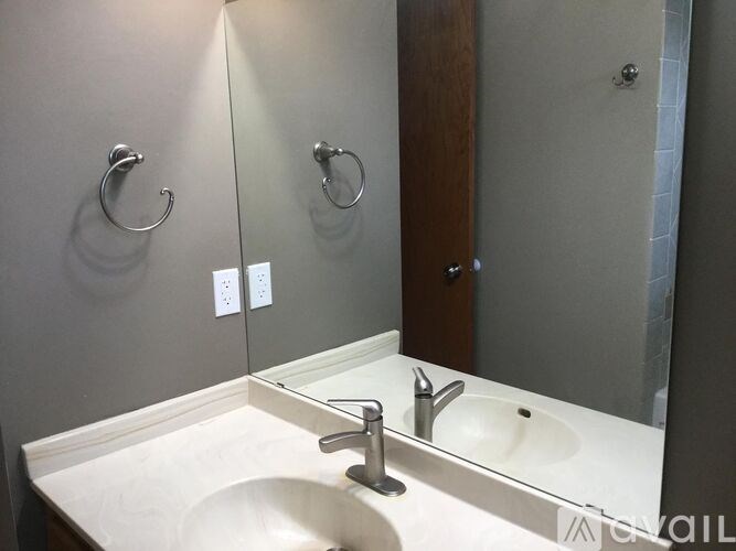 A bathroom sink with a mirror above it.