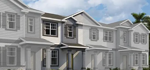 A modern two-story house with a combination of grey and white exterior.