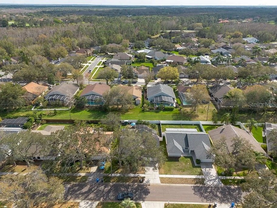 A suburban neighborhood with houses and trees.